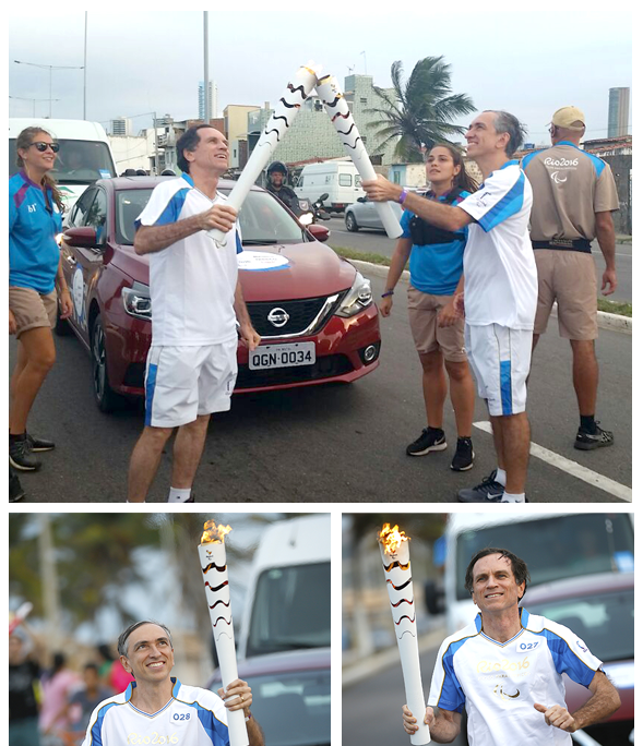 foto dos diretores da Miranda conduzindo a tocha paralimpica